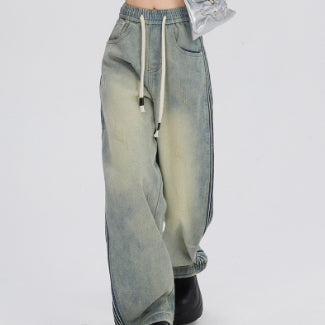 Jeans met elastische taille met rimpelontwerp aan de zijkant