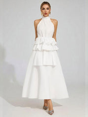 Vloeiende trouwjurk met ruches en een halterhalslijn