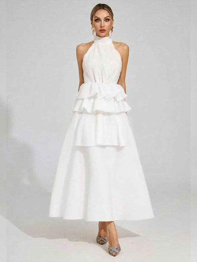 Vloeiende trouwjurk met ruches en een halterhalslijn